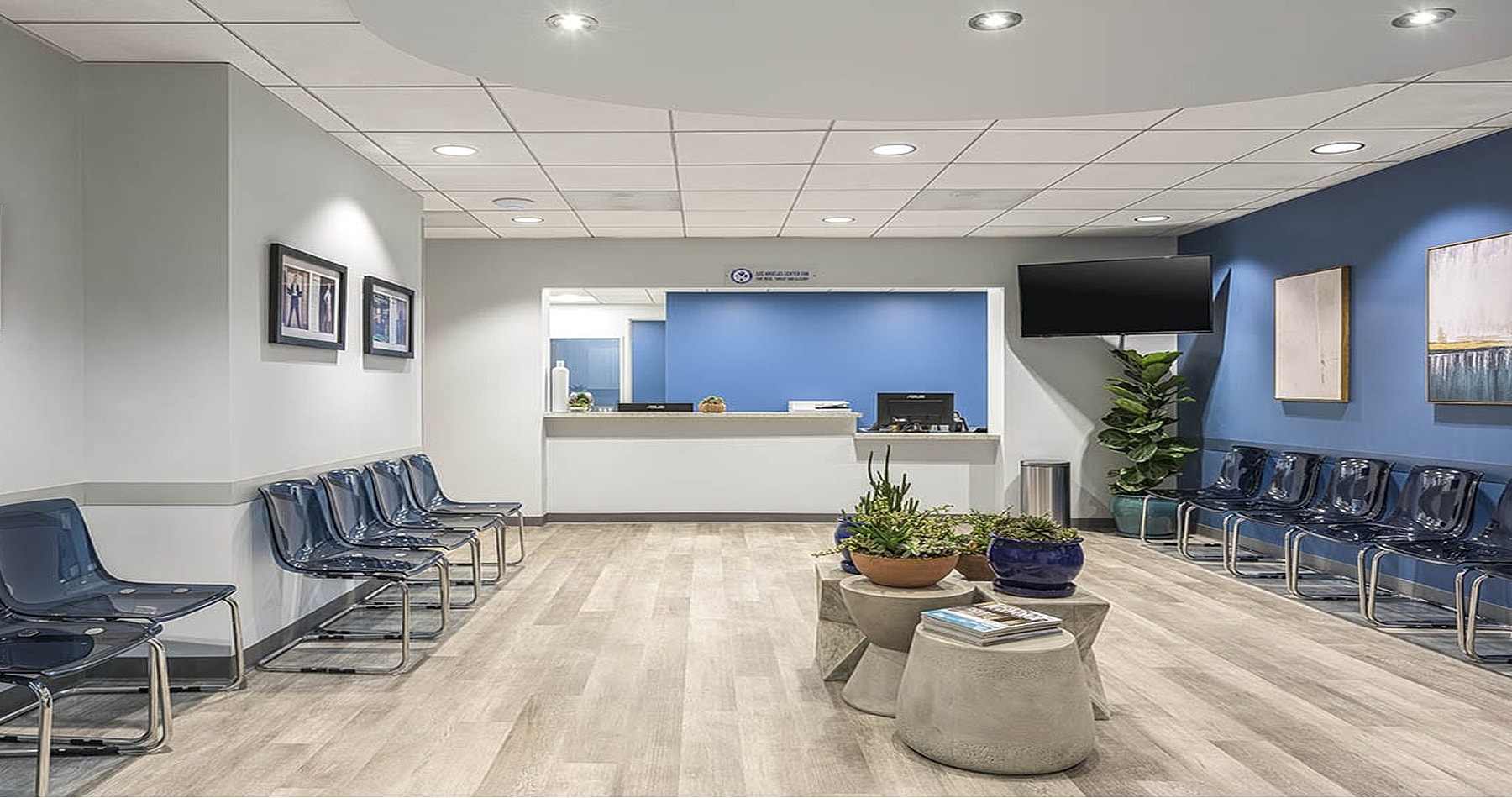 Modern waiting room with blue accent wall.