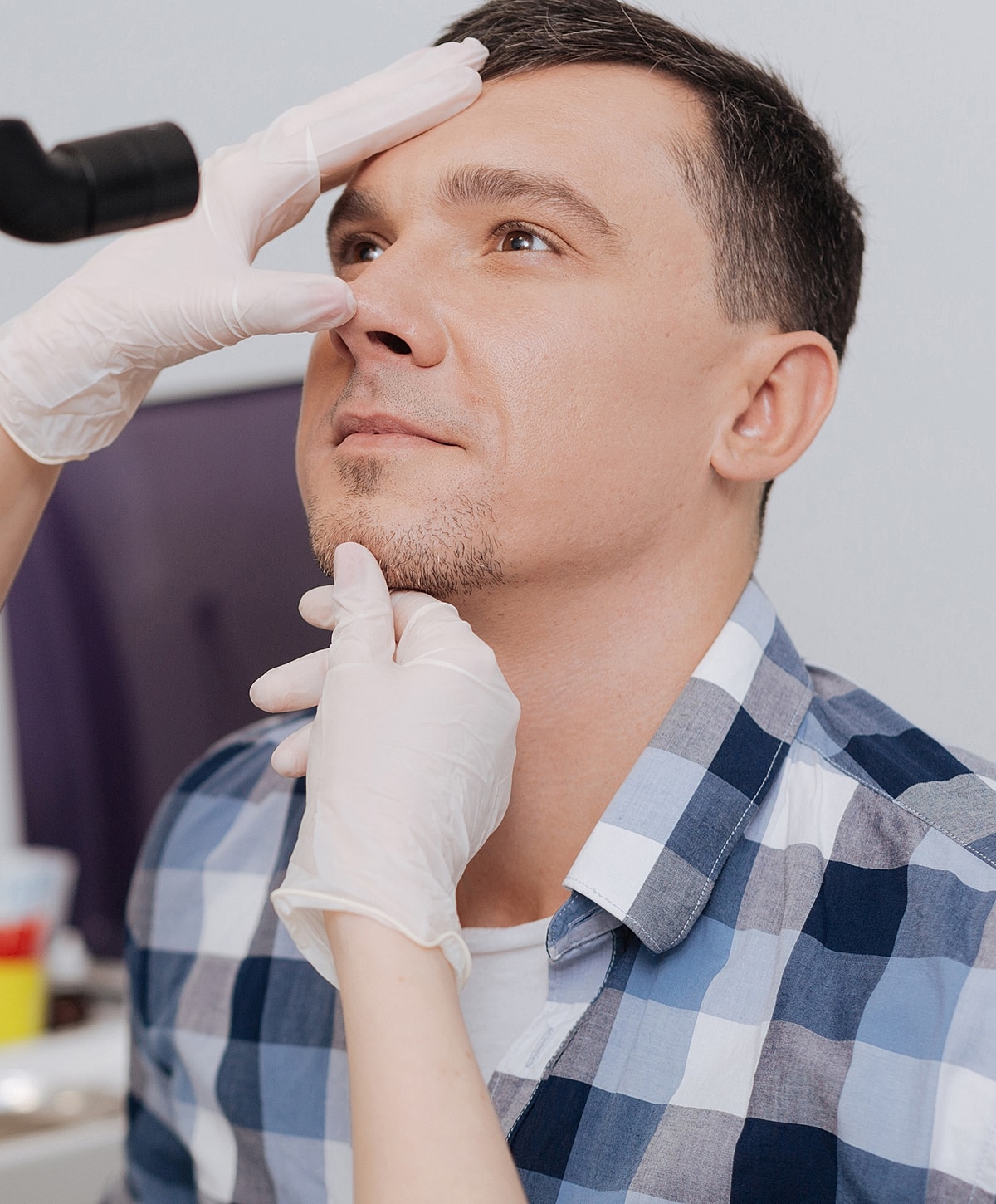 Facial grooming session between two individuals.