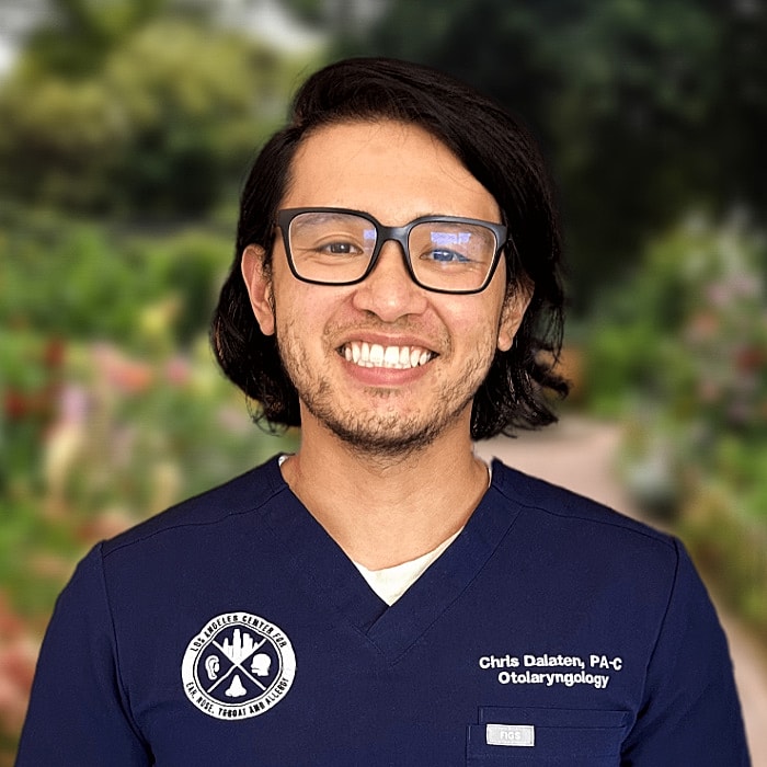 Smiling healthcare professional in medical scrubs.