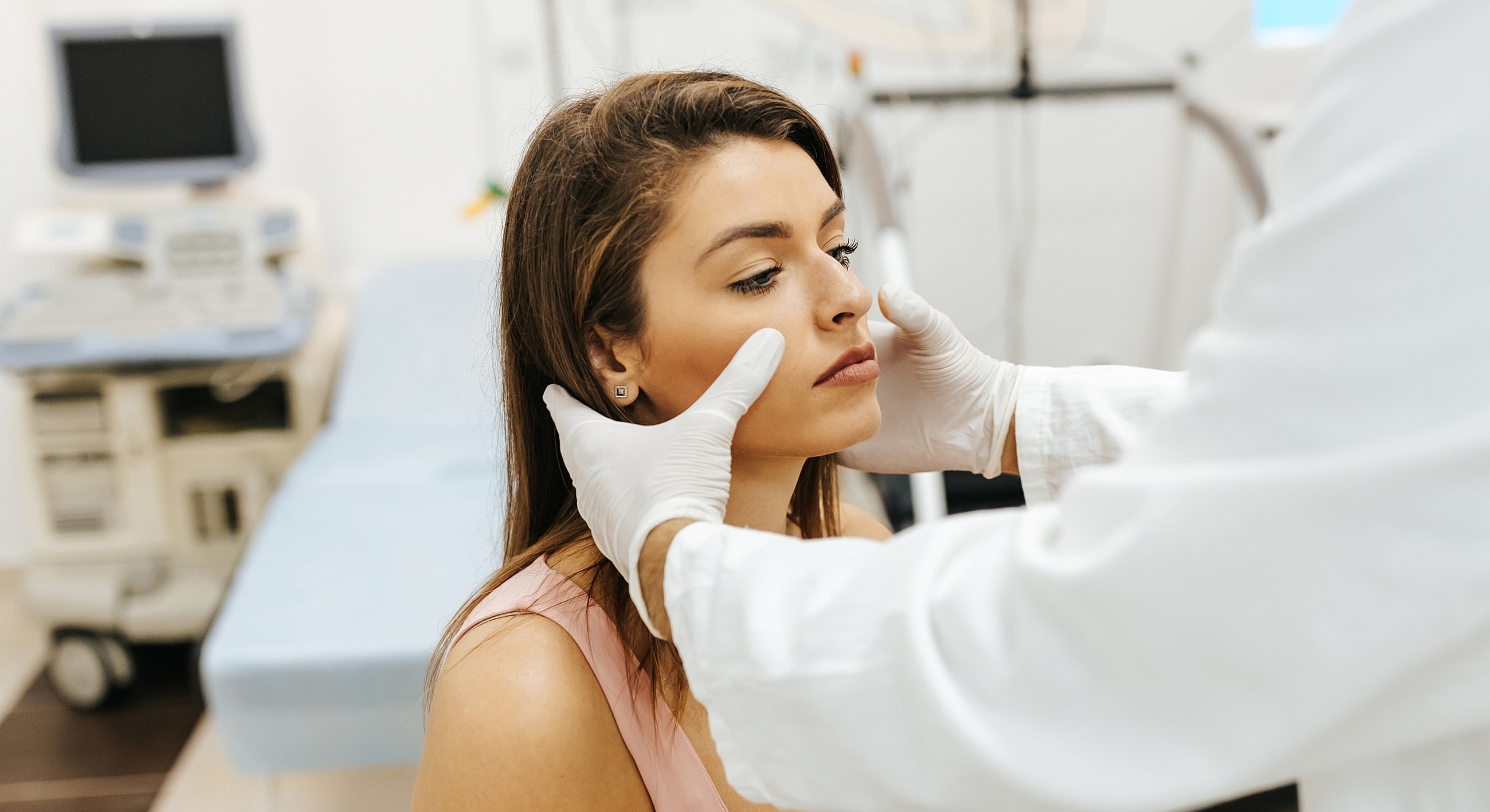 Consultation for cosmetic facial treatment in clinic.