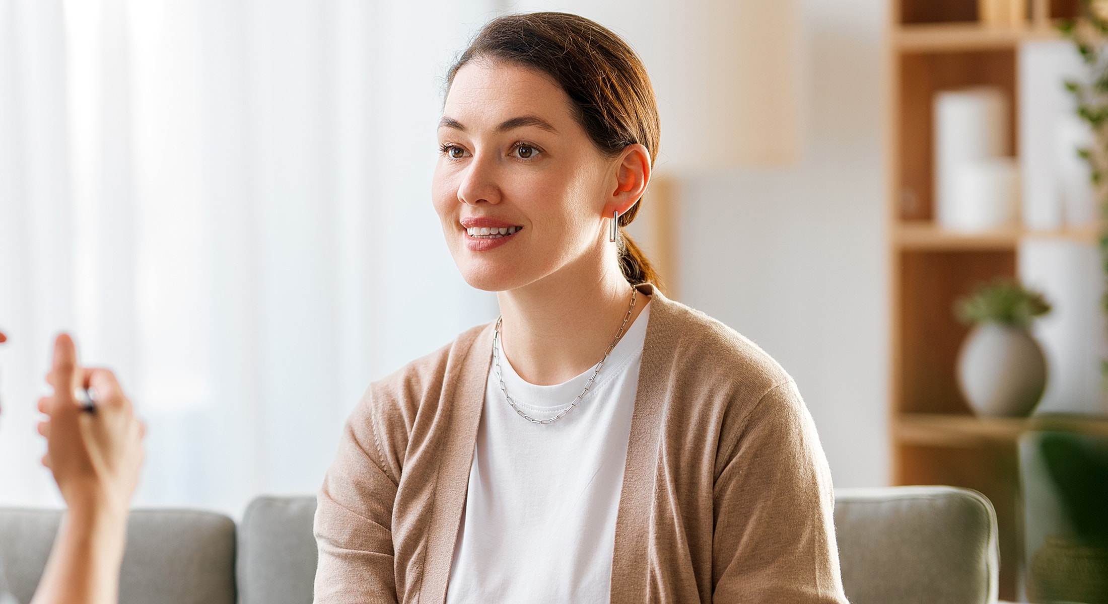 Person receiving a facial treatment or consultation.