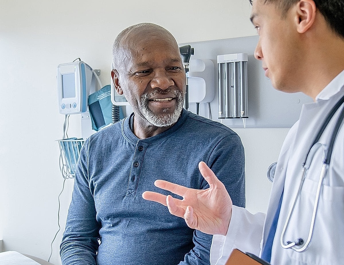 Doctor consulting with patient in medical office.